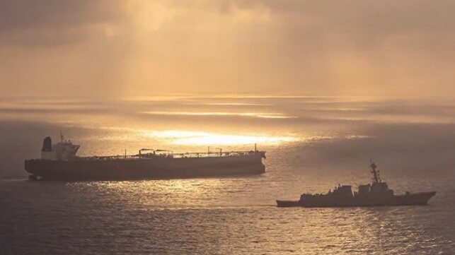 CENTCOM US warship and tanker in sunset